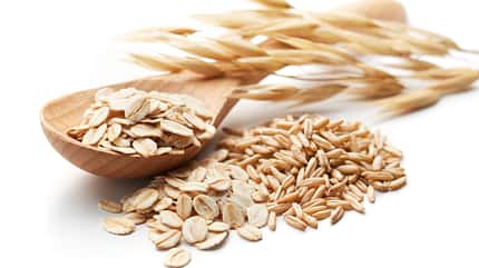 oat,rolled oat,processed grains, unprocessed, unmilled, grain, group, pile, scoop, groats, isolated, cereal, macro, raw, close up, scoop and pile of oatmeal with its unprocessed grains and plant oats