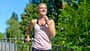 Happy healthy woman jogging outdoors