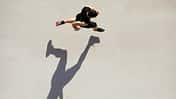 Sprinter seen from above with shadow and copy space.